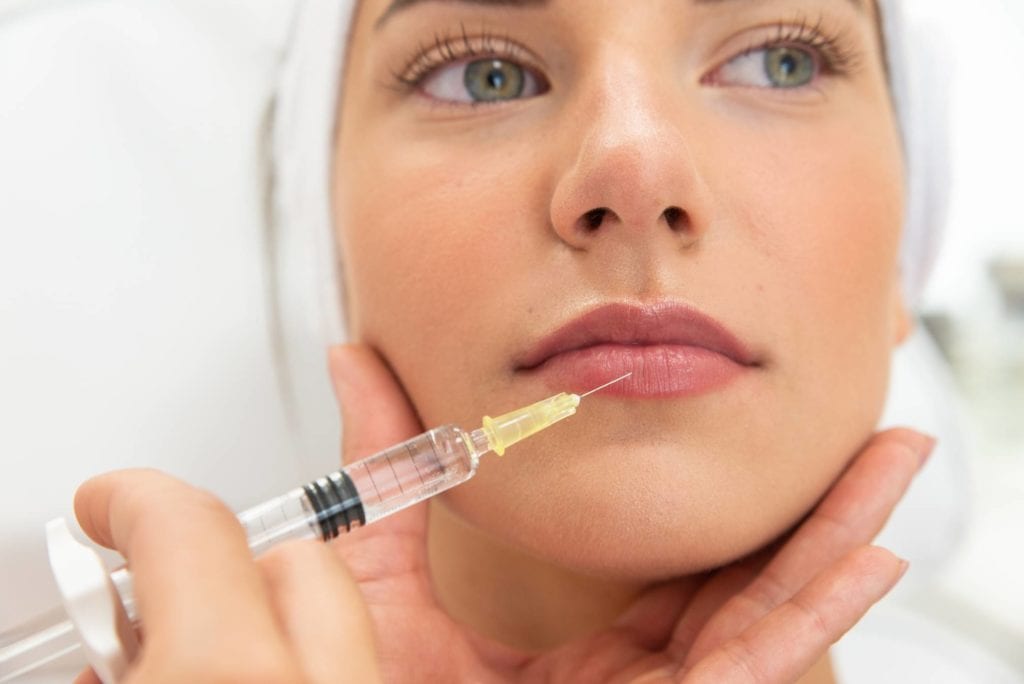 Woman getting lip filler treatment in Pleasanton, CA & Walnut Creek, CA | Encore MedSpa